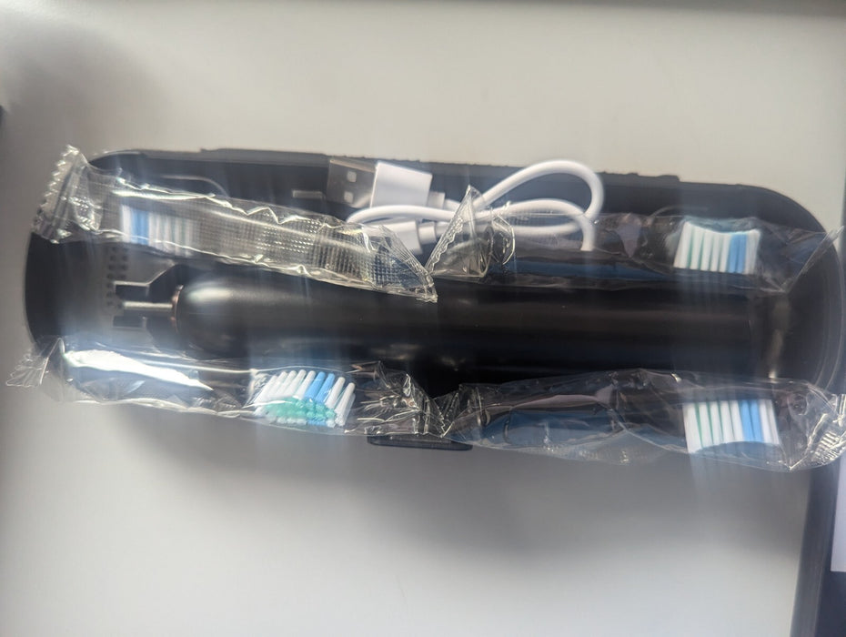 Electric Toothbrush with 4 heads charger lead and case